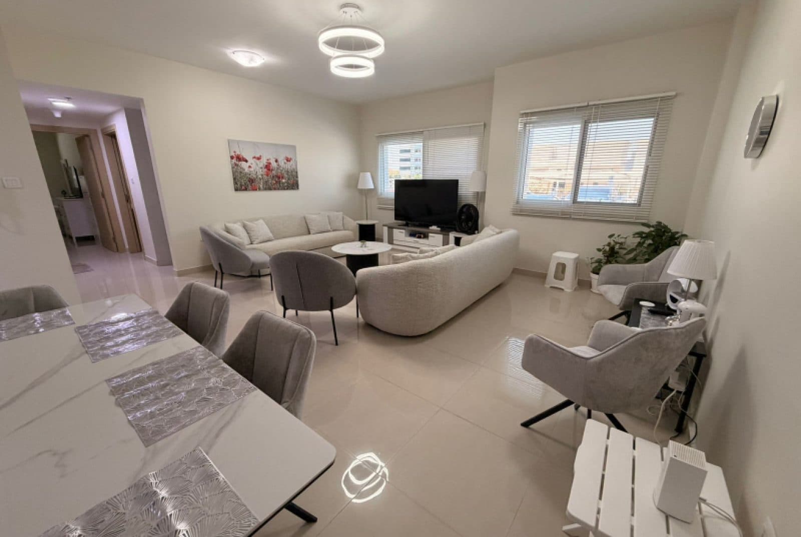 Living and dining room in a Dubai Sports City apartment, original photo
